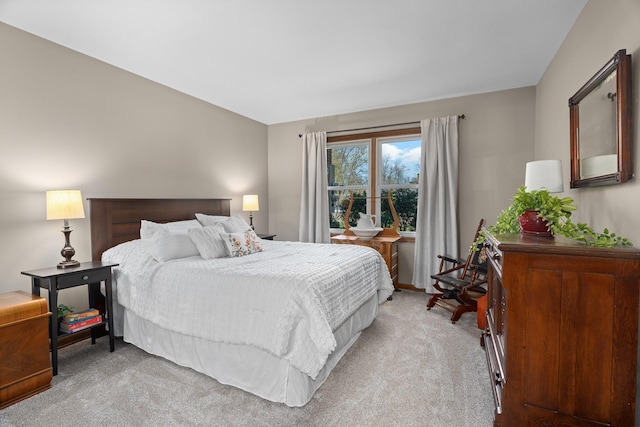 bedroom featuring light carpet