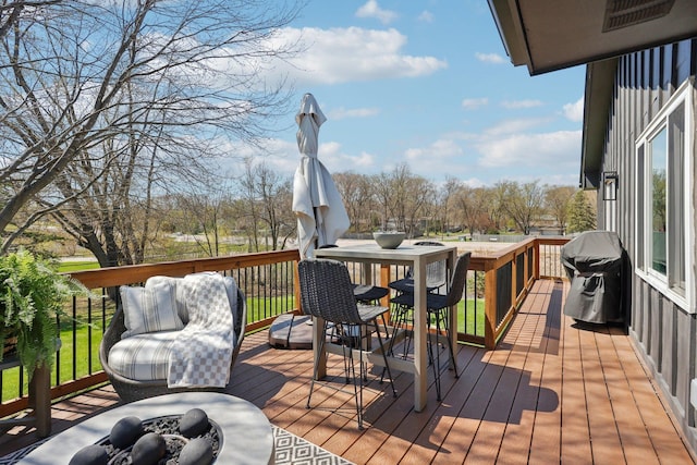 17725 26th Ave N, Plymouth, MN 55447 - wooden terrace with a fire pit, visible vents, and area for grilling