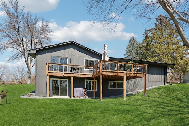 17725 26th Ave N, Plymouth, MN 55447 - rear view of property with a chimney, board and batten siding, a yard, and a deck