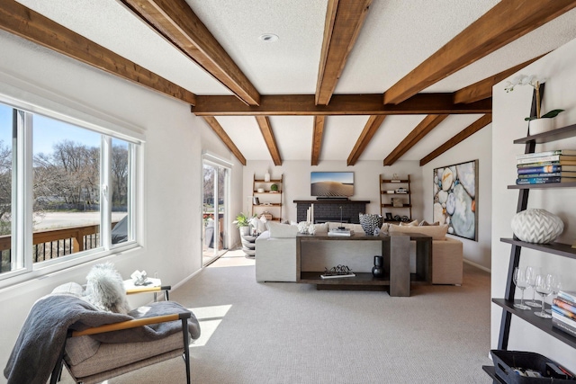 17725 26th Ave N, Plymouth, MN 55447 - carpeted living room with baseboards, vaulted ceiling with beams, and a fireplace