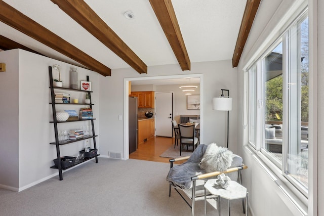 17725 26th Ave N, Plymouth, MN 55447 - living area featuring visible vents, baseboards, light carpet, and beamed ceiling