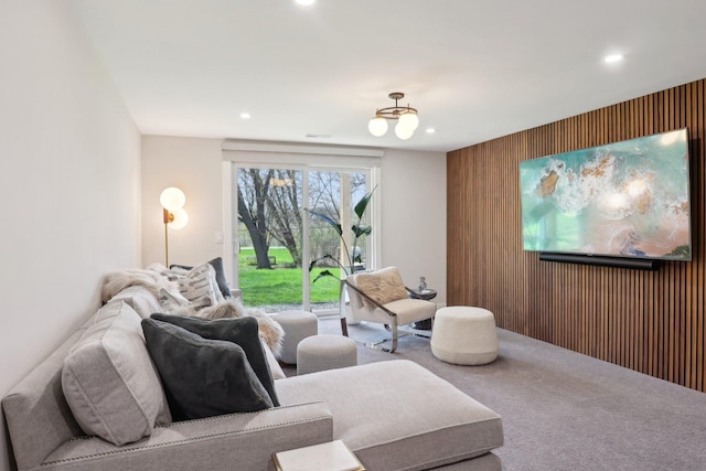 17725 26th Ave N, Plymouth, MN 55447 - carpeted living area featuring recessed lighting, an accent wall, and wooden walls