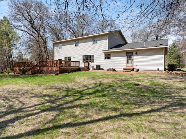 14898 Lynndale Ln, Baxter, MN 56425 - rear view of house featuring a deck, a lawn, and entry steps