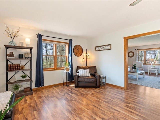 14898 Lynndale Ln, Baxter, MN 56425 - sitting room with wood finished floors and baseboards