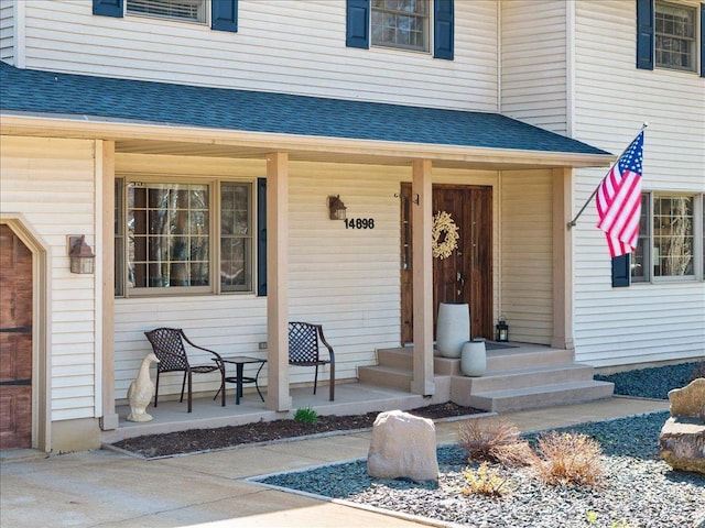 14898 Lynndale Ln, Baxter, MN 56425 - view of exterior entry featuring a porch and a shingled roof