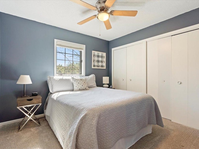 14898 Lynndale Ln, Baxter, MN 56425 - carpeted bedroom featuring multiple closets and a ceiling fan
