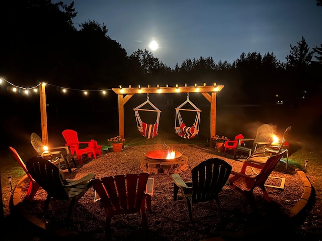 14898 Lynndale Ln, Baxter, MN 56425 - patio at twilight featuring a fire pit