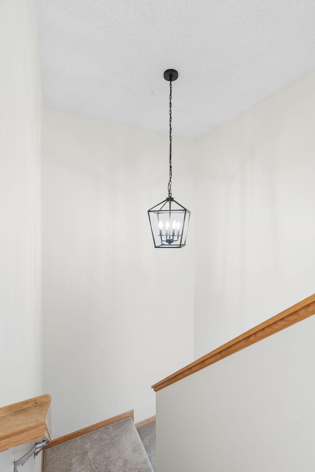 5030 Yuma Ln N, Plymouth, MN 55446 - detailed view of carpet floors, a chandelier, and baseboards
