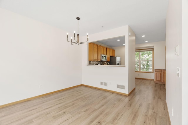 5030 Yuma Ln N, Plymouth, MN 55446 - unfurnished dining area with light wood-style flooring, a chandelier, baseboards, and recessed lighting