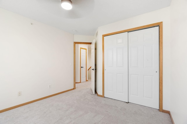 5030 Yuma Ln N, Plymouth, MN 55446 - unfurnished bedroom with light colored carpet, baseboards, and a closet
