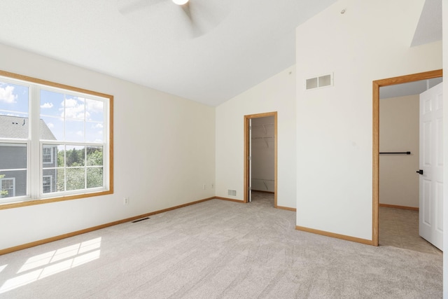5030 Yuma Ln N, Plymouth, MN 55446 - unfurnished bedroom with light carpet, baseboards, a spacious closet, ceiling fan, and a closet