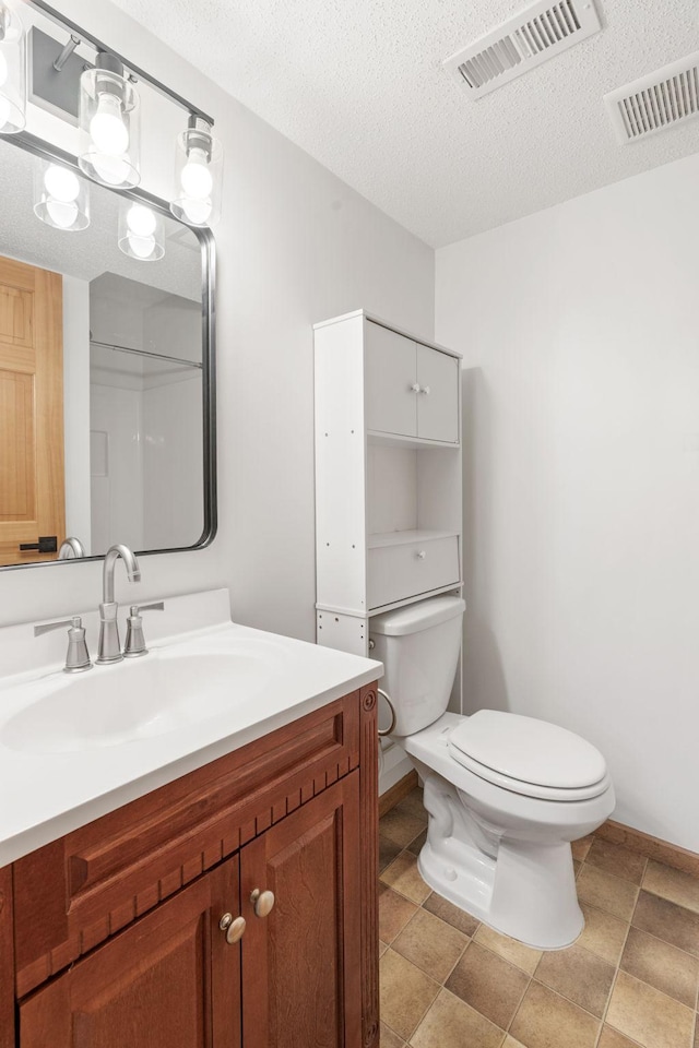 5030 Yuma Ln N, Plymouth, MN 55446 - bathroom featuring toilet, a textured ceiling, and vanity