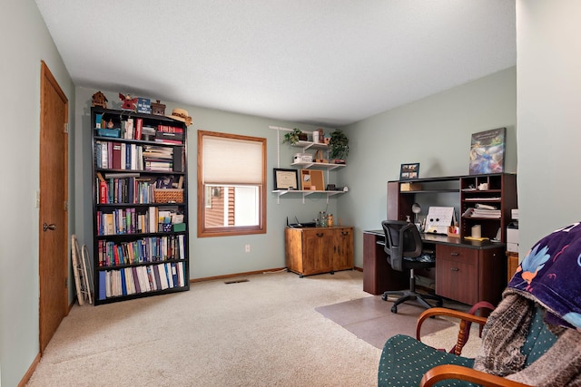 office with light colored carpet and baseboards