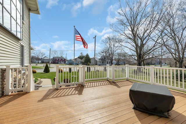 131 Norman Ave N, Foley, MN 56329 - wooden terrace featuring a lawn and a residential view