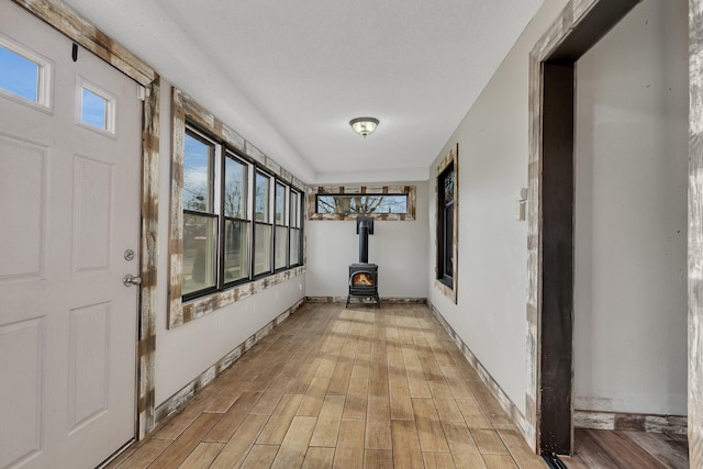 131 Norman Ave N, Foley, MN 56329 - hall featuring baseboards, a healthy amount of sunlight, and light wood finished floors
