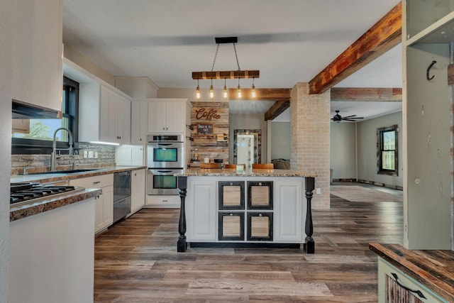 131 Norman Ave N, Foley, MN 56329 - kitchen featuring white cabinetry, appliances with stainless steel finishes, a sink, and dark wood finished floors