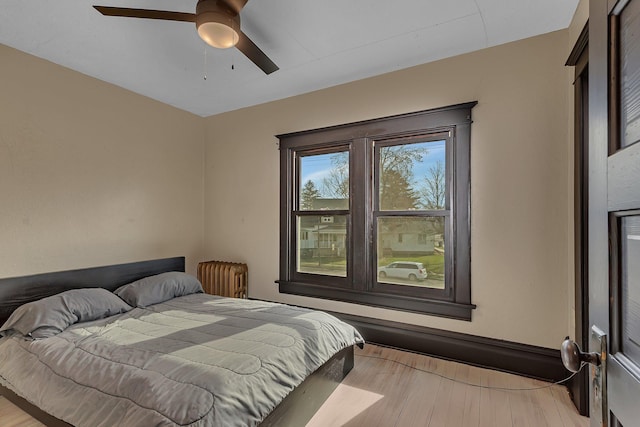 131 Norman Ave N, Foley, MN 56329 - bedroom with ceiling fan and wood finished floors