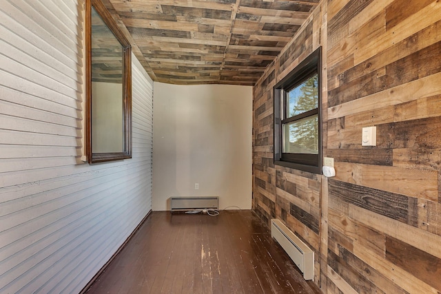 131 Norman Ave N, Foley, MN 56329 - hallway featuring wood walls, baseboard heating, and hardwood / wood-style floors