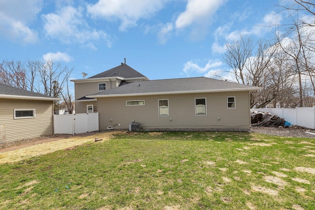131 Norman Ave N, Foley, MN 56329 - rear view of property with a lawn, cooling unit, and a fenced backyard