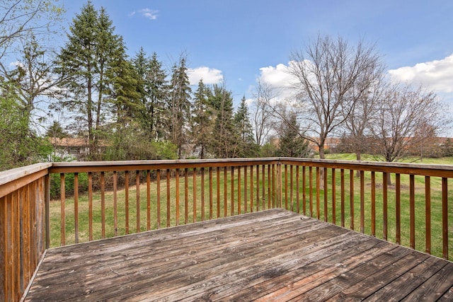 wooden deck with a yard