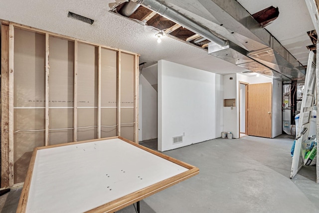 unfinished basement featuring visible vents
