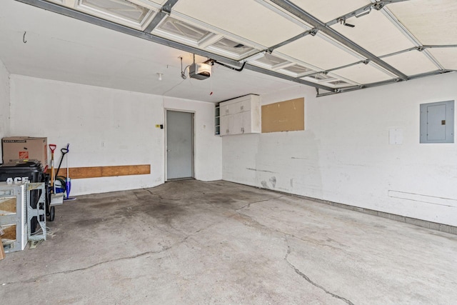 garage featuring a garage door opener and electric panel