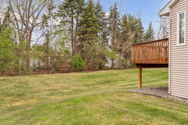view of yard with a wooden deck