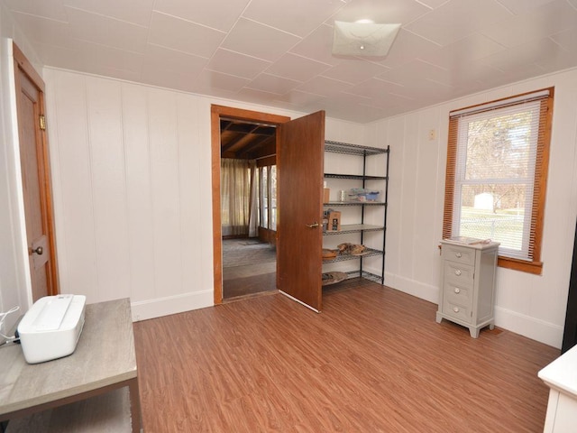 bedroom featuring baseboards and wood finished floors