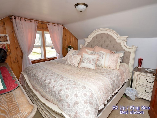bedroom featuring light carpet and lofted ceiling