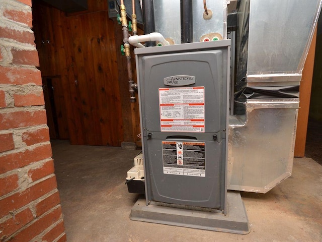 utility room featuring heating unit