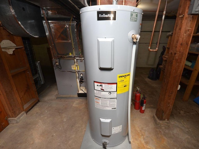 utility room featuring water heater