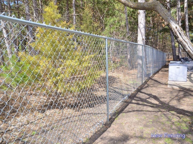 view of gate featuring fence