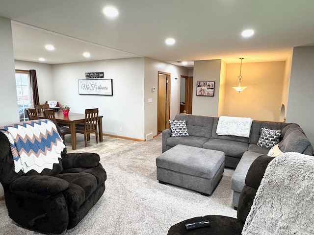 living area with recessed lighting, carpet flooring, and baseboards