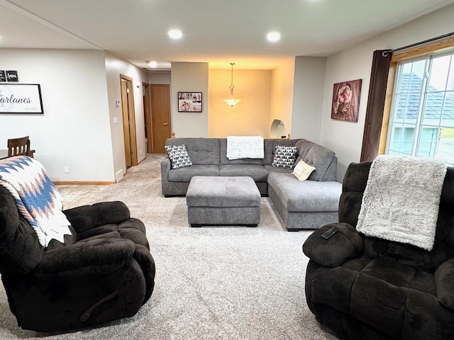living room with recessed lighting, baseboards, and carpet