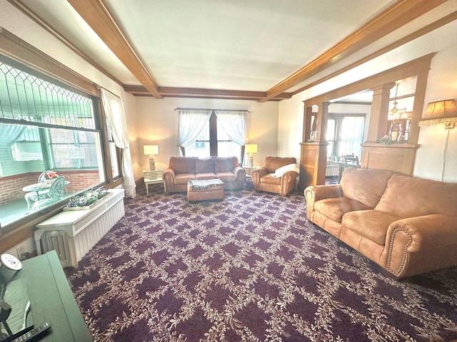 living room with carpet flooring and ornamental molding