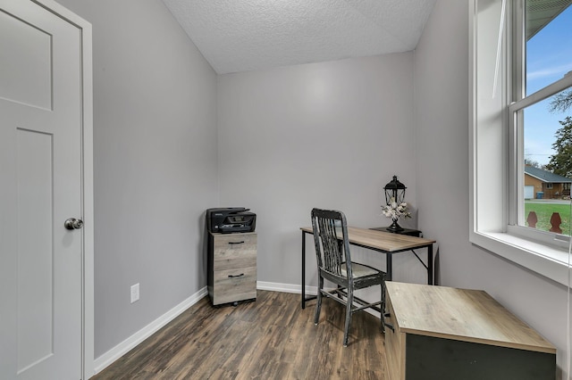 home office featuring baseboards, a textured ceiling, and dark wood finished floors