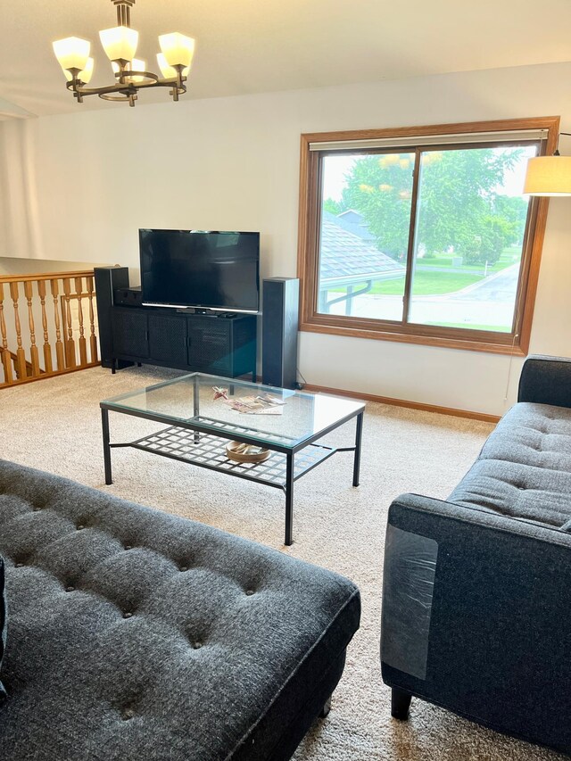 816 3rd St S, Sartell, MN 56377 - living area featuring carpet flooring, a chandelier, and baseboards