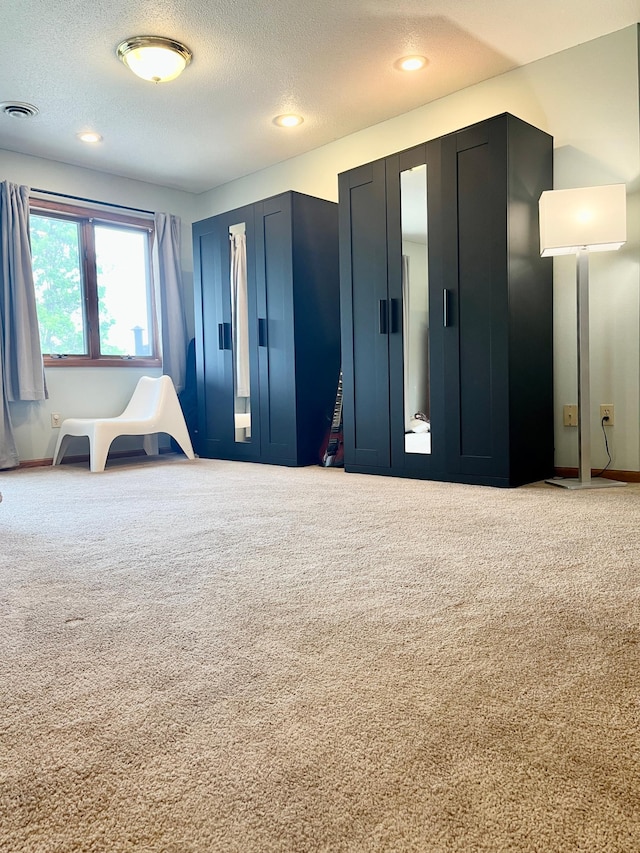 816 3rd St S, Sartell, MN 56377 - carpeted bedroom featuring a textured ceiling and recessed lighting
