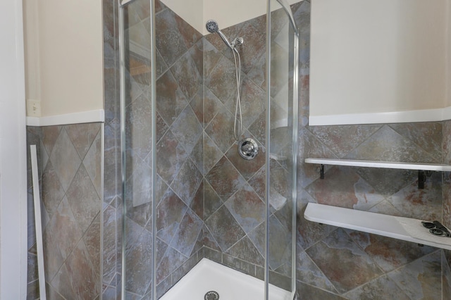 bathroom featuring a shower stall