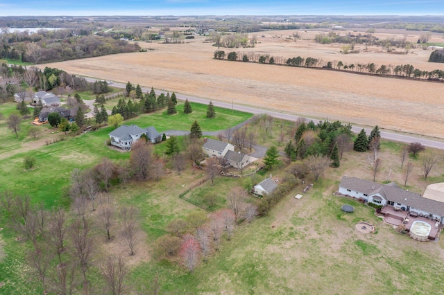 birds eye view of property with a rural view