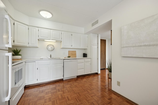 7200 York Ave S Unit 304, Edina, MN 55435 - kitchen featuring white appliances, a sink, light countertops, and white cabinets