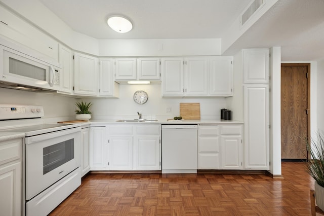 7200 York Ave S Unit 304, Edina, MN 55435 - kitchen featuring white appliances, light countertops, white cabinetry, and a sink