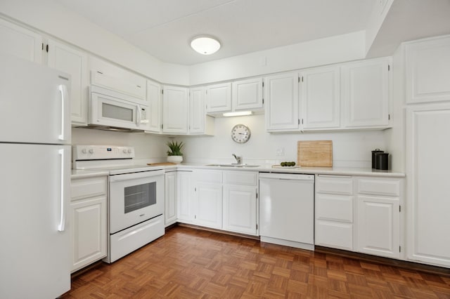 7200 York Ave S Unit 304, Edina, MN 55435 - kitchen with white appliances, a sink, light countertops, and white cabinetry