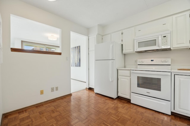 7200 York Ave S Unit 304, Edina, MN 55435 - kitchen with white appliances, white cabinetry, light countertops, and baseboards