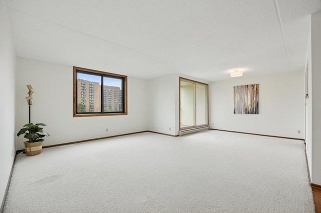 7200 York Ave S Unit 304, Edina, MN 55435 - spare room featuring baseboards and light colored carpet