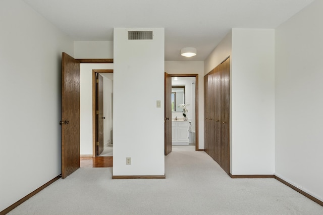 7200 York Ave S Unit 304, Edina, MN 55435 - unfurnished bedroom featuring a closet, carpet, and baseboards