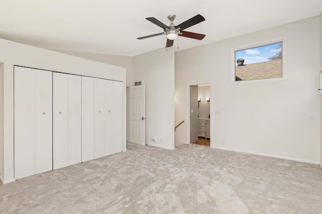 unfurnished bedroom featuring visible vents, baseboards, a closet, ensuite bathroom, and carpet