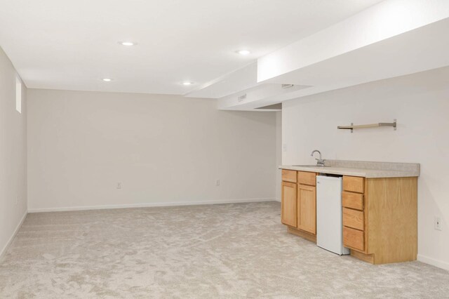 bar with wet bar, light colored carpet, a sink, baseboards, and recessed lighting