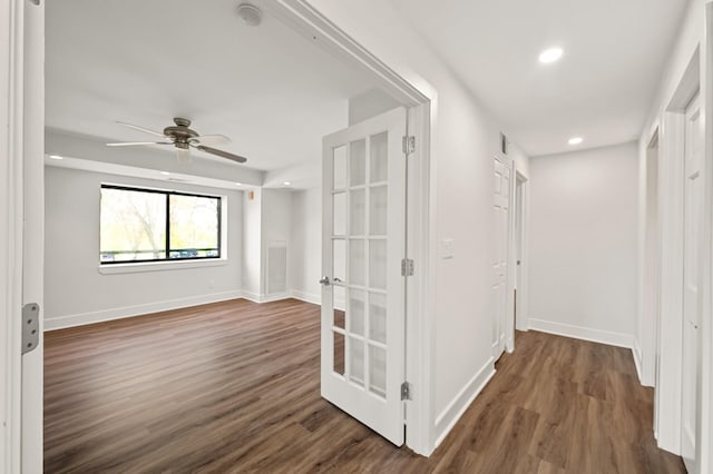 interior space with baseboards, recessed lighting, dark wood-style flooring, and french doors