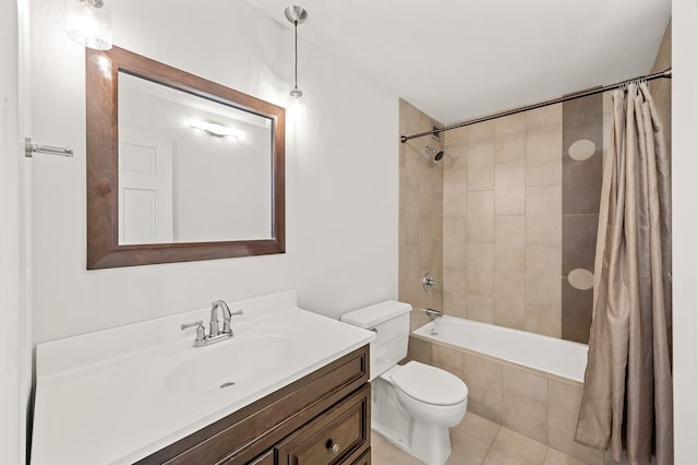 full bathroom featuring tiled shower / bath combo, toilet, tile patterned floors, and vanity